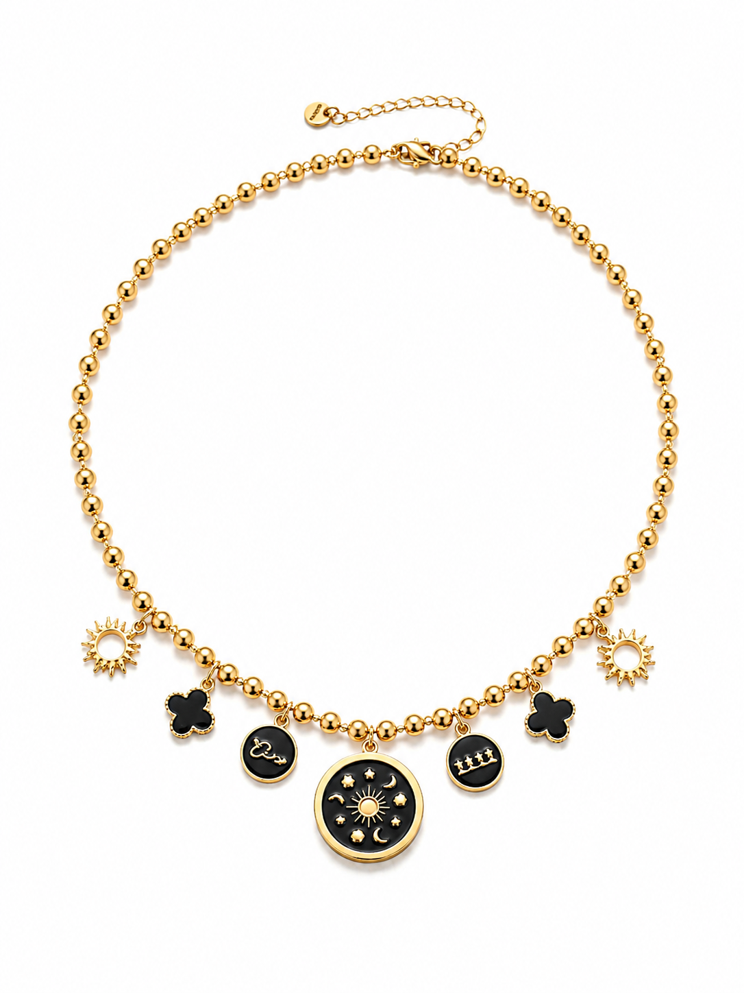 A gold beaded necklace with celestial and clover-themed charms, including a central moon-and-stars medallion, on a clean white background.