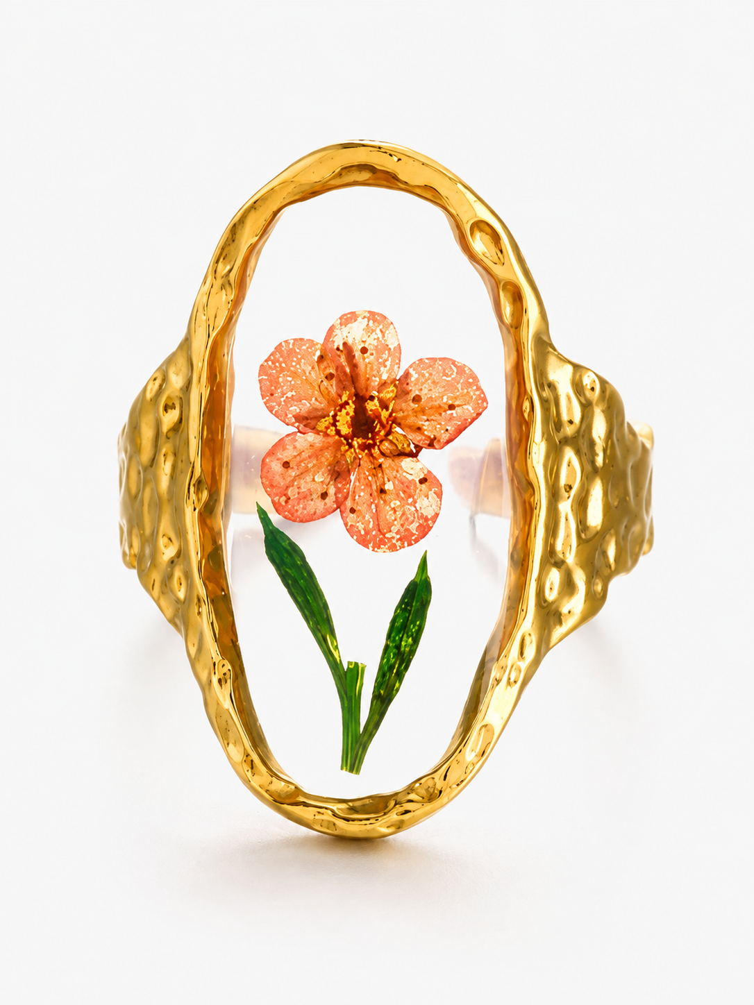 Gold botanical ring featuring a preserved peach flower encased in clear resin with an organic textured band on a white background.